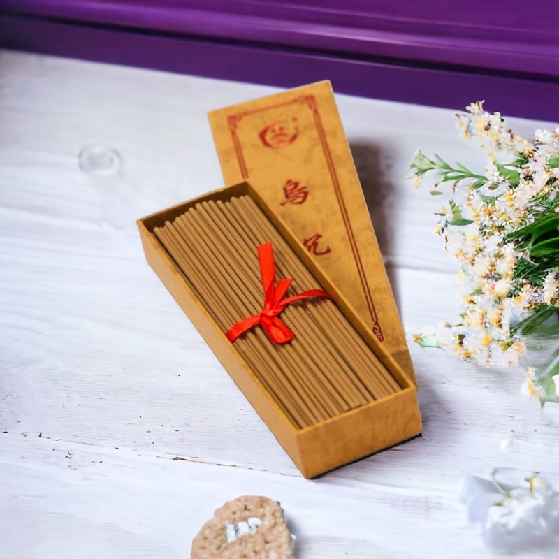Luxury agarwood incense sticks in a handcrafted gift box with ribbon